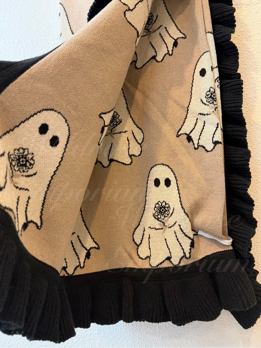 Cupcakes and Cashmere ghost holding bouquet flowers ruffled hem knit throw viral - Picture 5 of 9